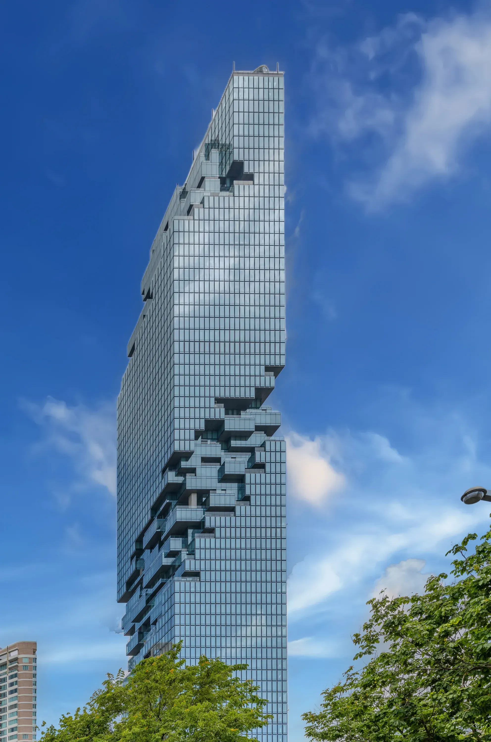 MahaNakhon tower against a blue sky